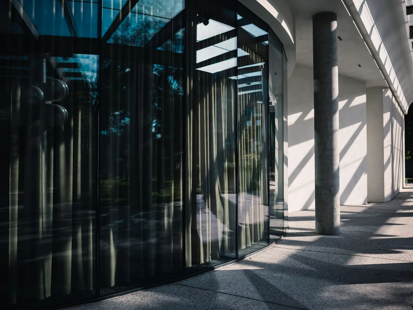Installer applying solar control film to commercial storefront glass